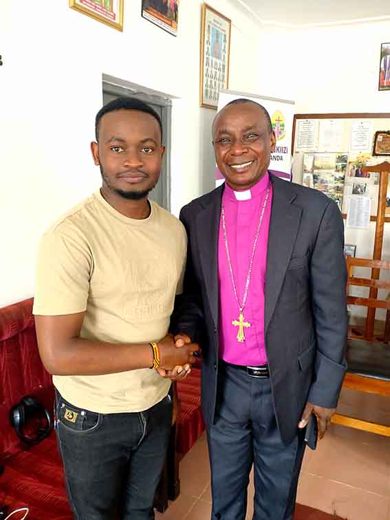 Bishop Zoreka with the writer, Kefa Senoga