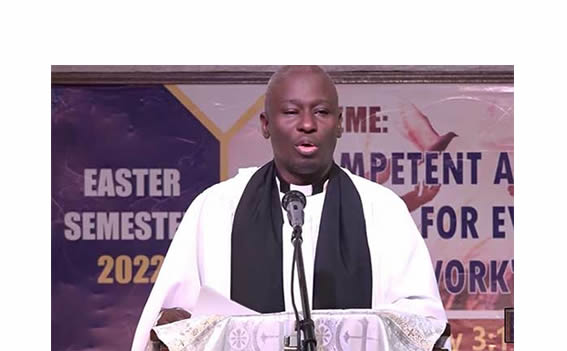 Rev. Dr. Henry Majwala preaching during a service at UCU