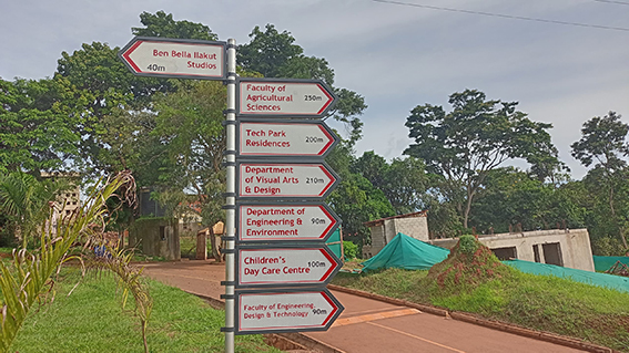 A directional sign at UCU’s main campus of the Ben Bella Illakut Studios