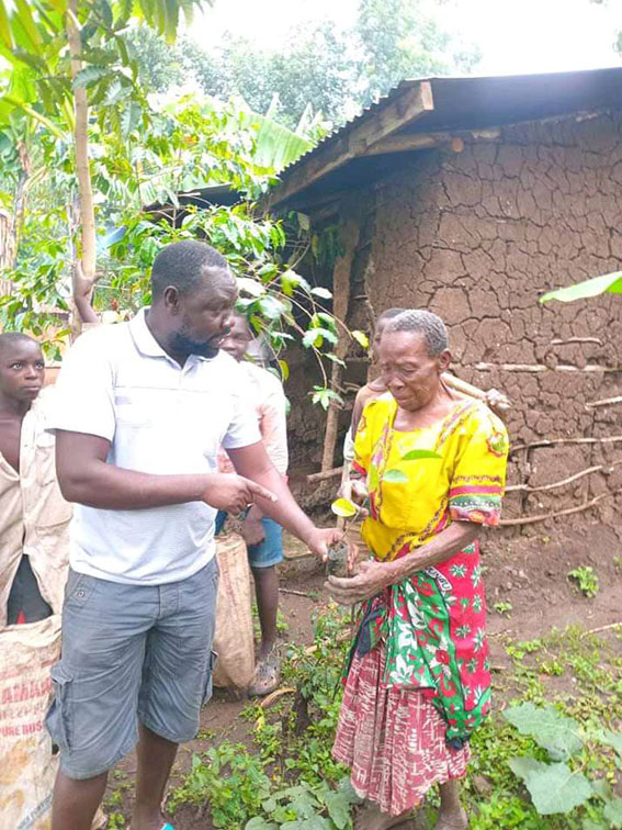 Jeremiah Mbulamani with one of the beneficiaries from the charity of his organization.
