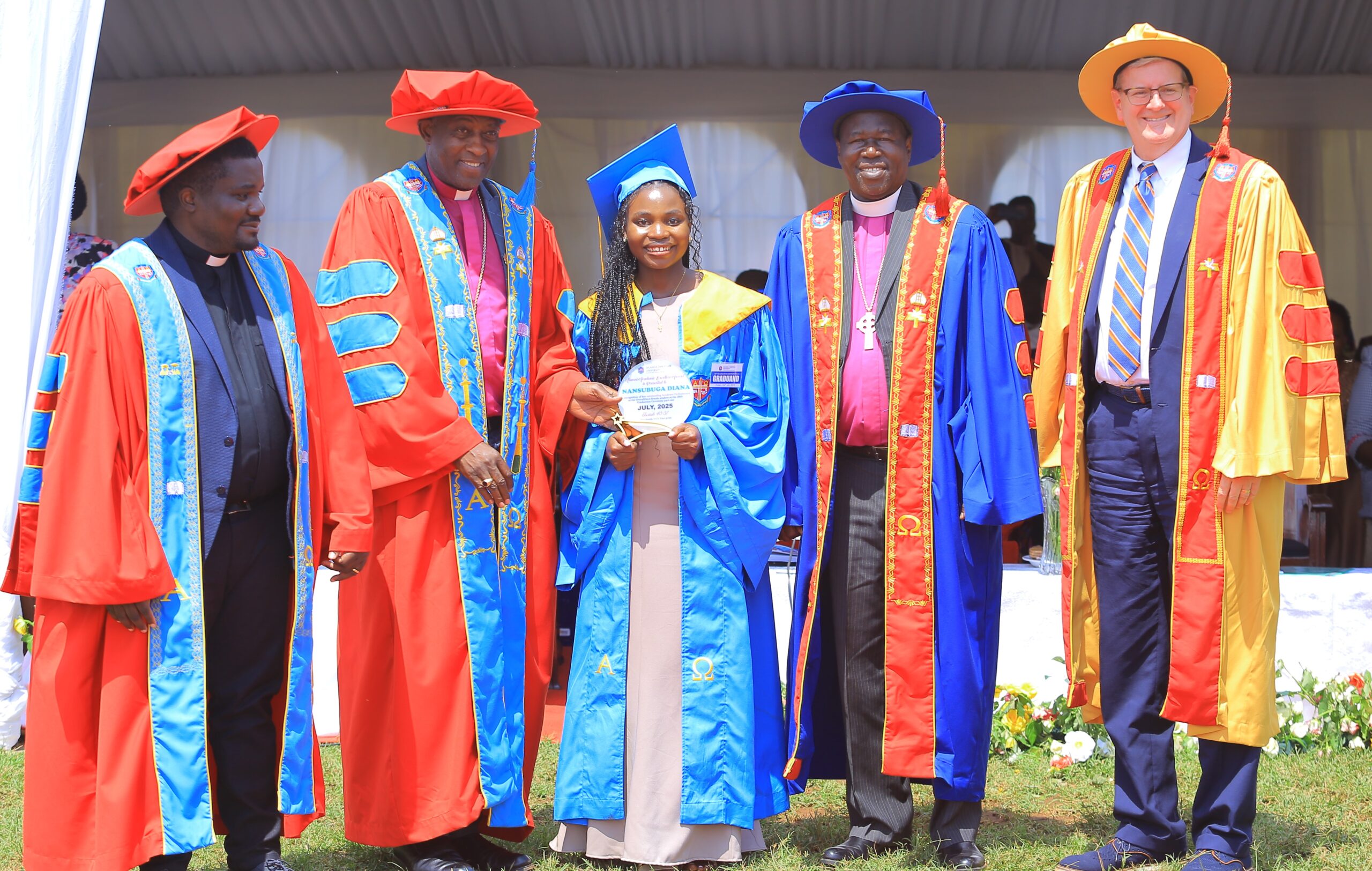 Diana Nansubuga receives the Best Female Student award from the Chancellor of Uganda Christian University, the Archbishop of the Church of Uganda, the Most Rev. Dr. Stephen Kaziimba Mugalu, during the graduation ceremony on July 4, 2025.