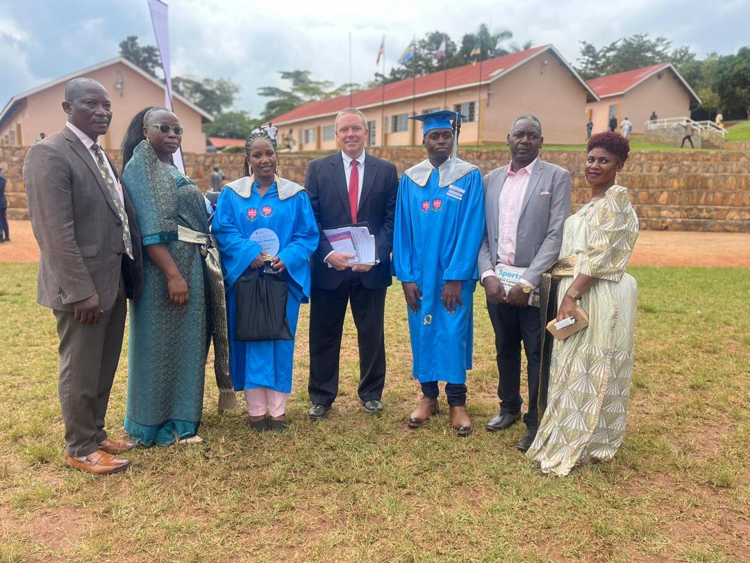 Timothy Kirabo receives his best student award during the commissioning service in Nkoyoyo Hall on July 3.