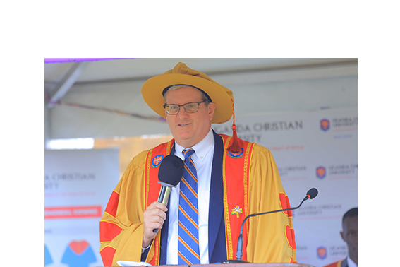 Wheaton College President Philip Ryken dressed in UCU academic regalia during his public address at the July 2025 UCU graduation ceremony