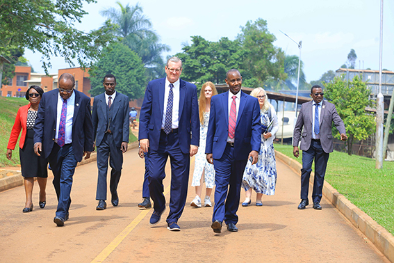 Ryken (center), accompanied by UCU Vice Chancellor, Prof. Aaron Mushengyezi (front, right), during a guided tour of the UCU campus.