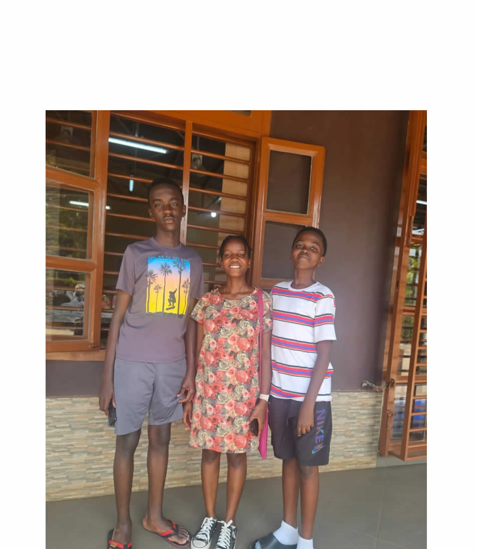 Christine Mirembe with her brothers