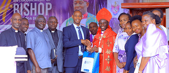 The UCU delegation, led by Vice Chancellor Prof. Aaron Mushengyezi handing over a gift to Bishop Grace Lubaale