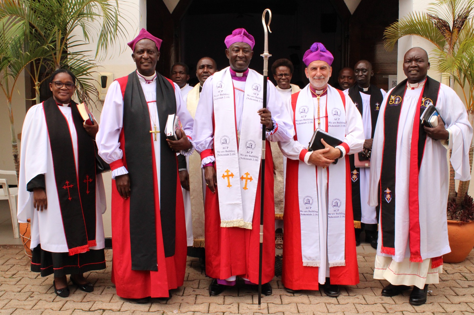The Rev. Canon Dr. Rebecca Nyegenye, the Dean at All Saints’ Cathedral Kampala, at left, poses with Hannington Mutebi, retired Assistant Bishop of the Diocese of Kampala; The Most Rev. Dr. Samuel Stephen Kaziimba Mugalu, the ninth Archbishop of the Church of Uganda; Bishop Foley Beach, retired Archbishop of Anglican Church in North America; and the Retired Diocesan Secretary, Rev. Canon John Awodi, after a Sunday service at All Saints’ Cathedral Kampala in 2024.