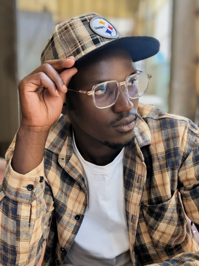 Okello uses proceeds from his artwork to support his mother