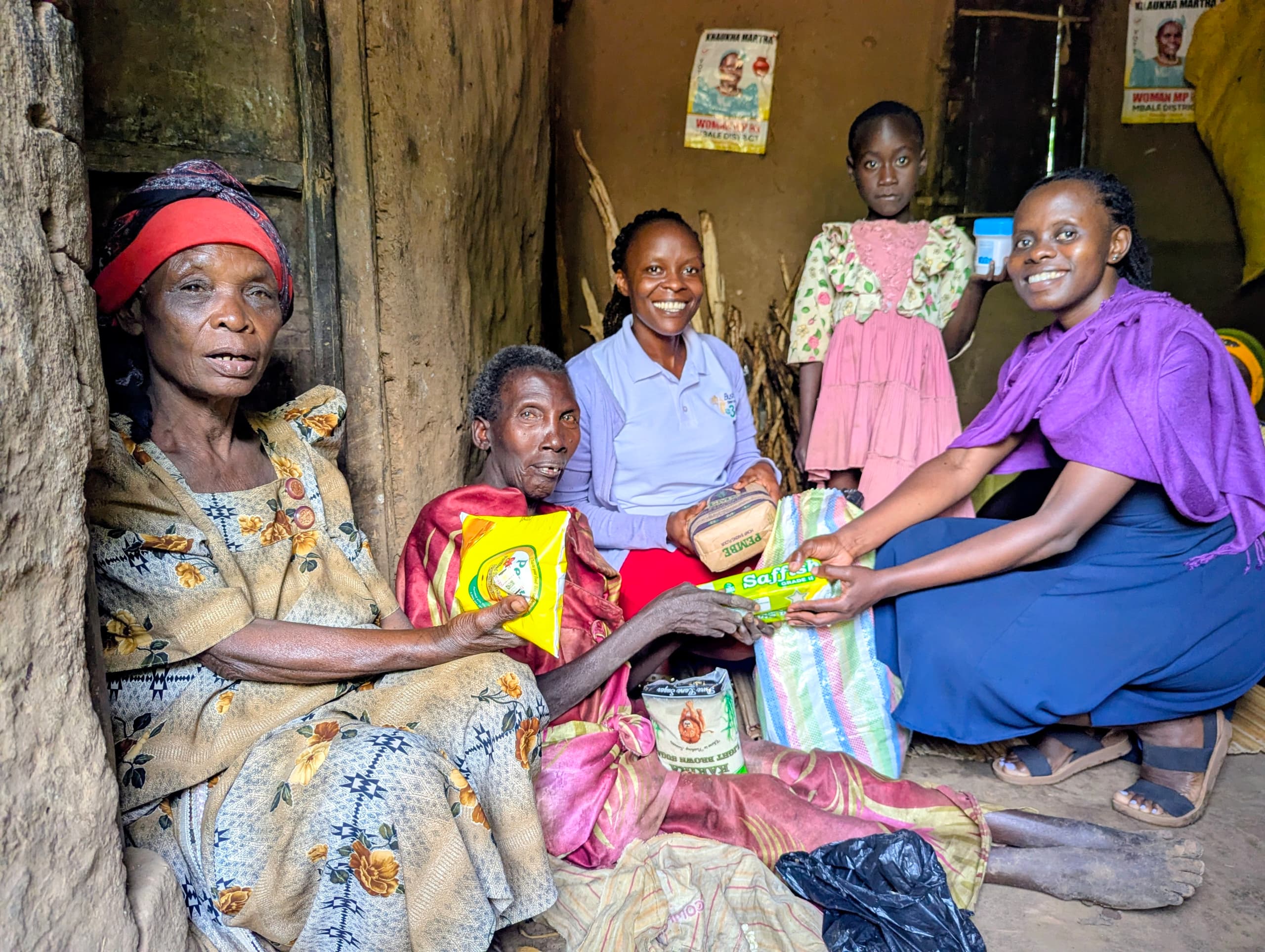 Bessie Lunyolo (center) during community outreach