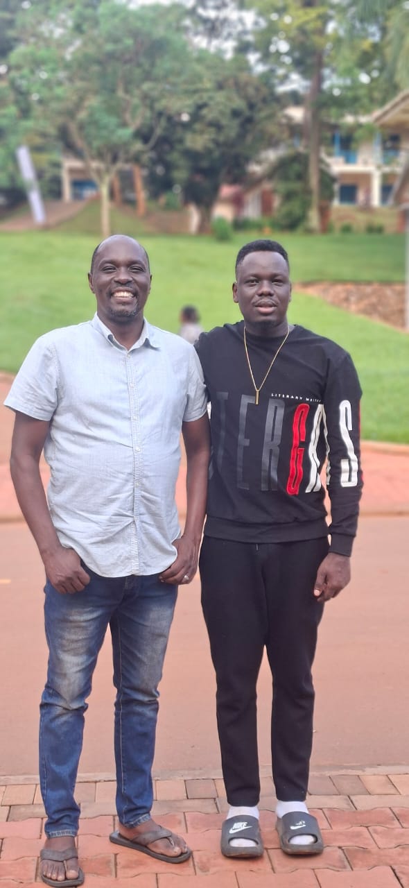 Francis Ojok, right, on the UCU campus during a recent conversation with Frank Obonyo, left, who teaches in the university School of Journalism, Media and Communication.
