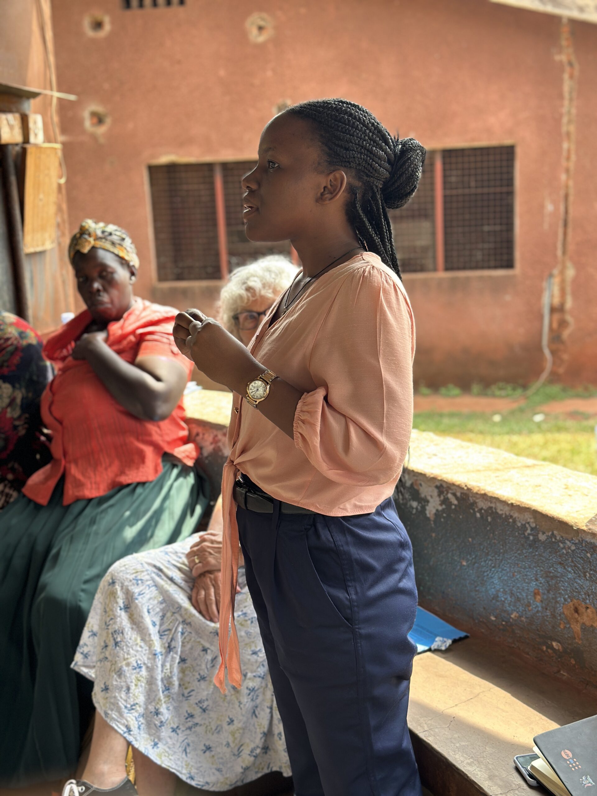 Linda Ojore, UCU School of Medicine student whose tuition is sponsored by Uganda Partners, speaks to a group of 26 health care workers in Jinja.