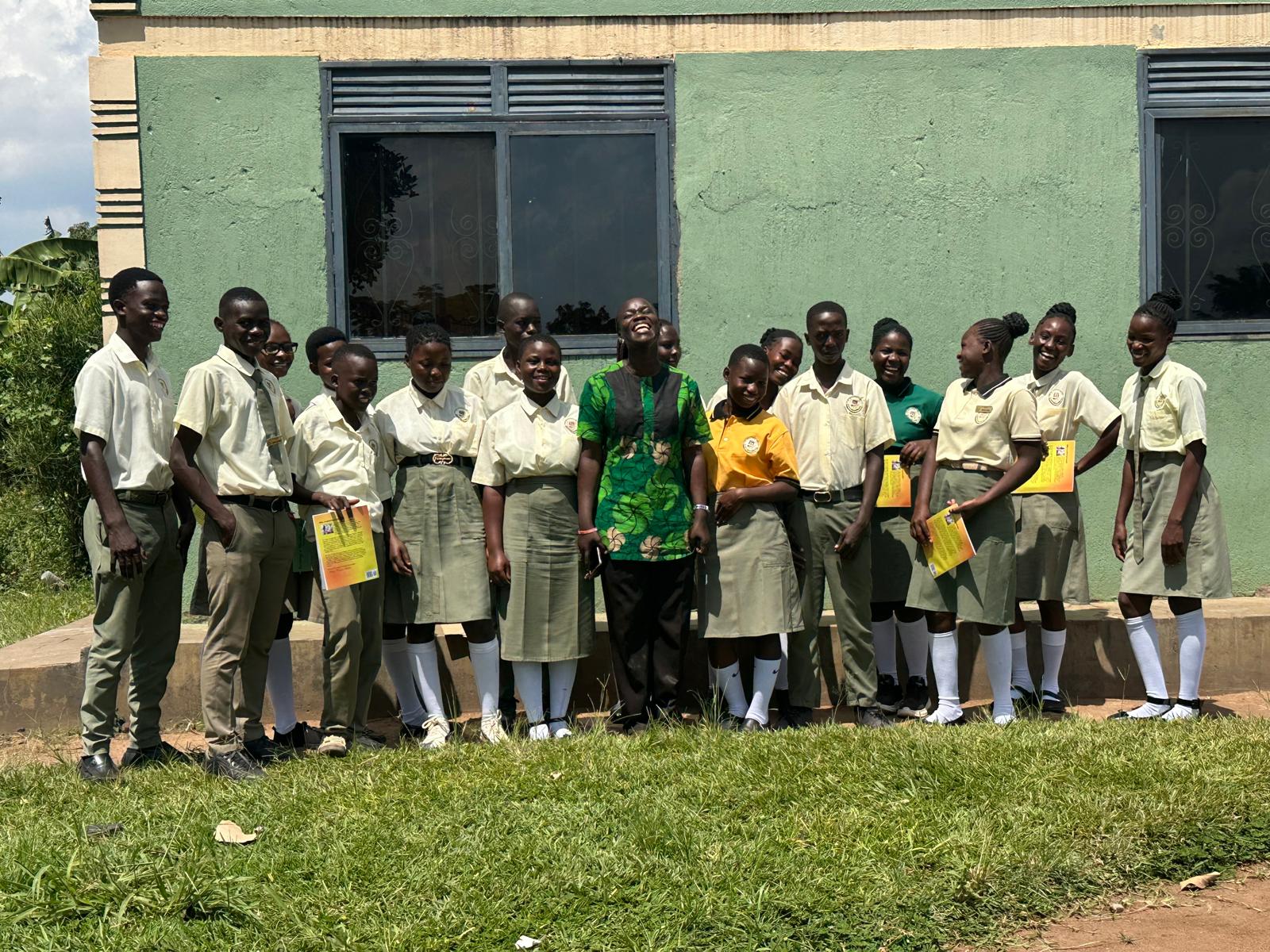 Sarah Igambi Nakayima Walamaku, a graduate of Uganda Christian University’s School of Education, with some of her students at Luwero/Nakaseke (Seal of Chris High School) in June 2026