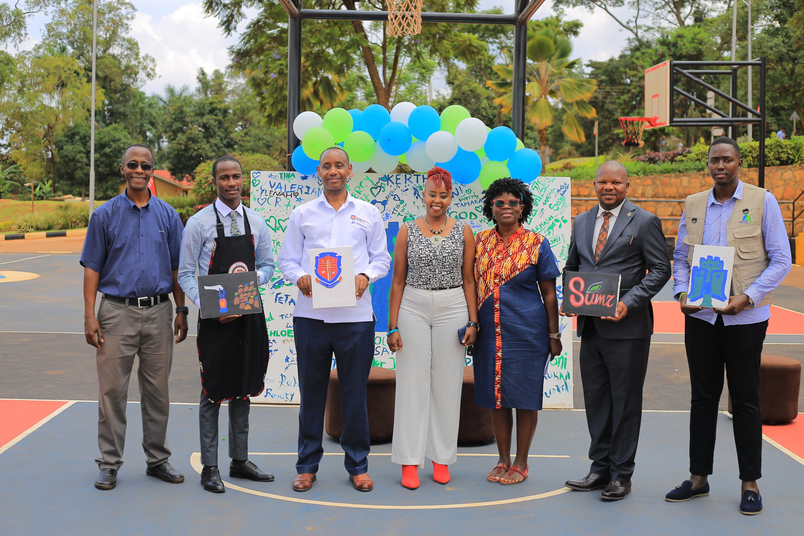 Dorothy Tushemereirwe, fundraising consultant, facilitated a March 2026 paint & coffee event to help students with tuition at Uganda Christian University (UCU). Among participants were (left to right) Daniel Karibwije, UCU School of Business lecturer; Abraham Elomaboni, UCU-Mukono Guild President; UCU Vice Chancellor, Prof. Aaron Mushengyezi; Josephine Merete, visual Arts & Designer and UCU lecturer; Tushemereirwe; Psalms Foods CEO, Dr. Dennis Ngabirano; and Dickson Mbonye, founder of Fortress Care Uganda, a mental health and youth empowerment initiative at UCU.