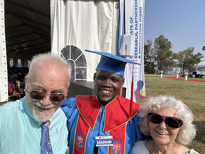 Mike and Patty with Jimmy Siyasa at his 2026 UCU graduation with a master’s degree in strategic communications